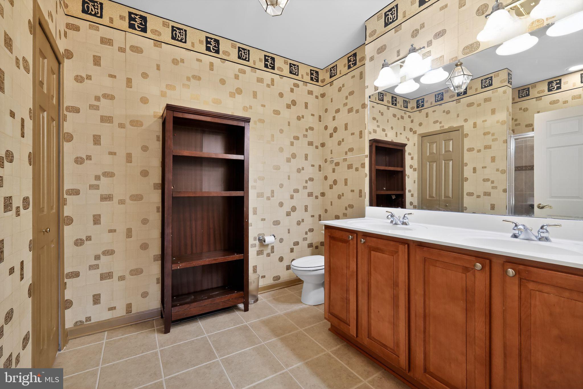 2007 Connor Court, Unit 701J Bowie, MD 20721 - Photo 15 of 15 a bathroom with a double vanity sink and a mirror