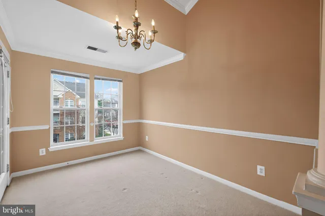 a view of empty room with windows