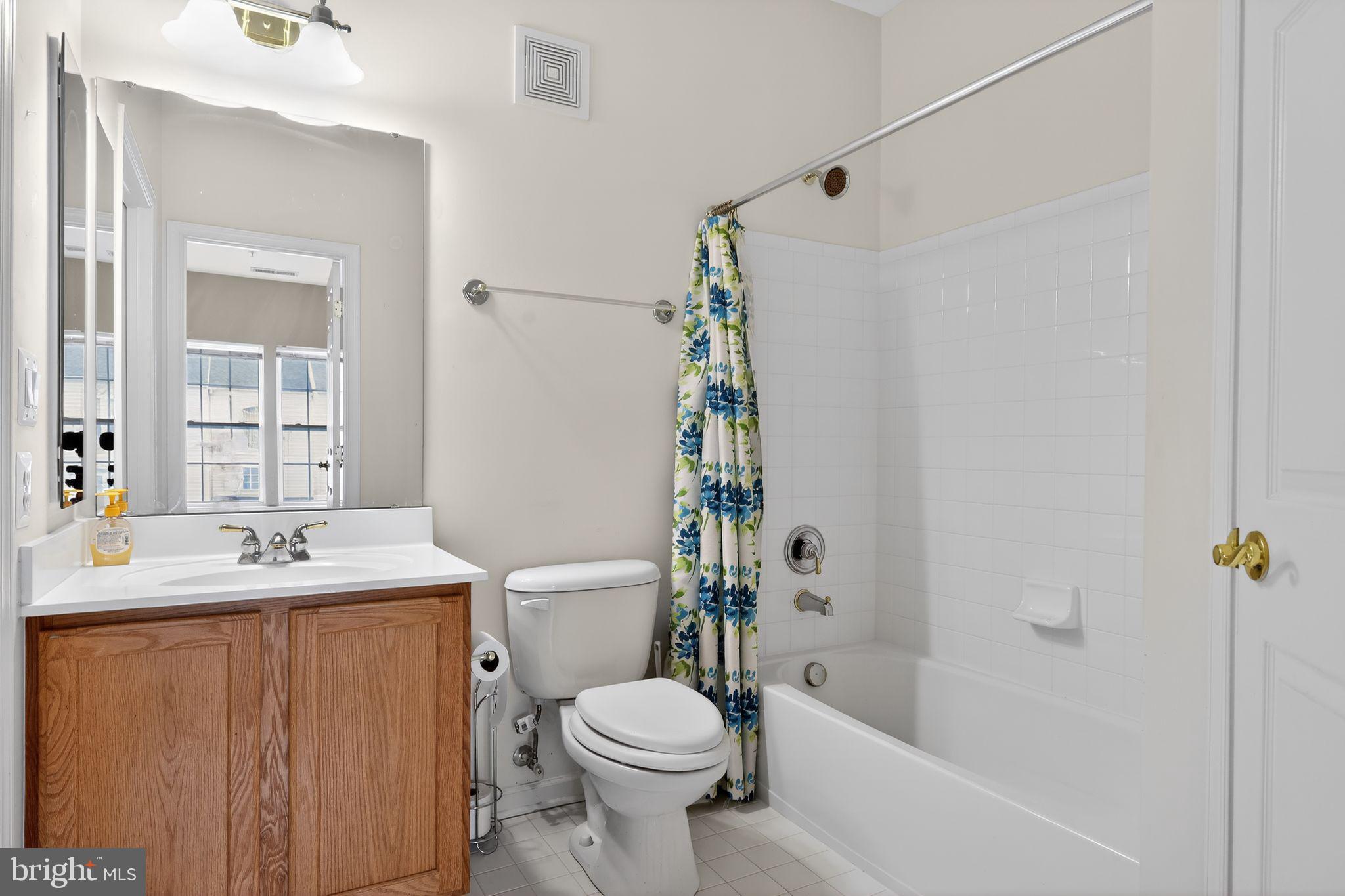 2007 Connor Court, Unit 701J Bowie, MD 20721 - Photo 8 of 15 a bathroom with a sink toilet and shower