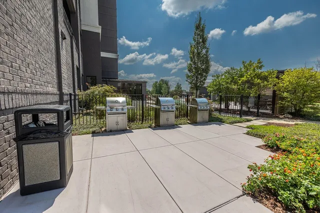 a view of a pathway with a buildings in the background