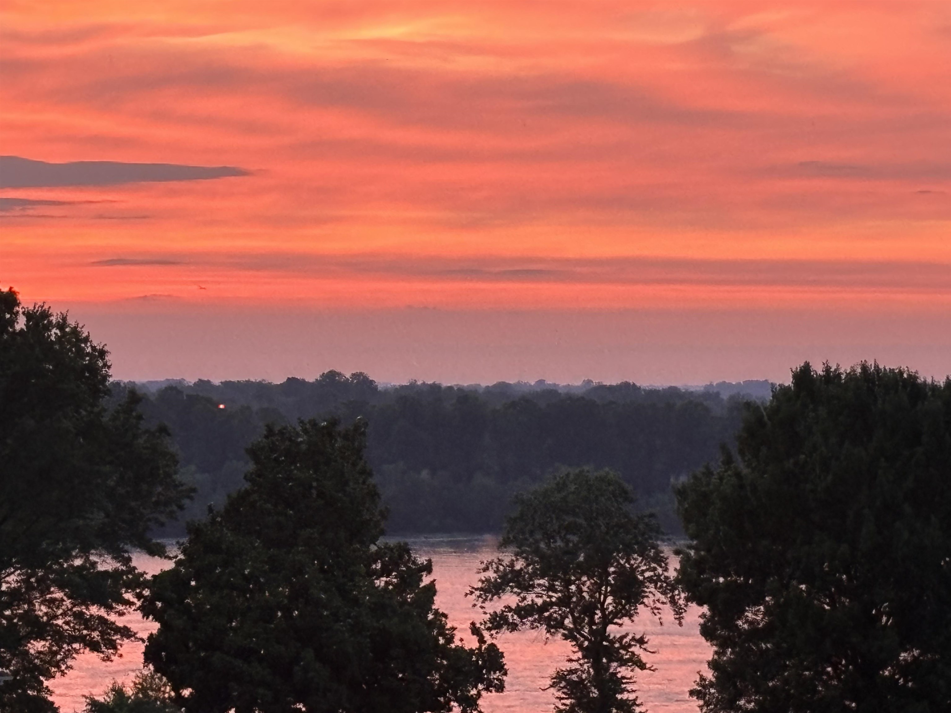 717 Riverside Drive, Unit 506 Memphis, TN 38103 - Photo 36 of 37 a view of a city with sunset