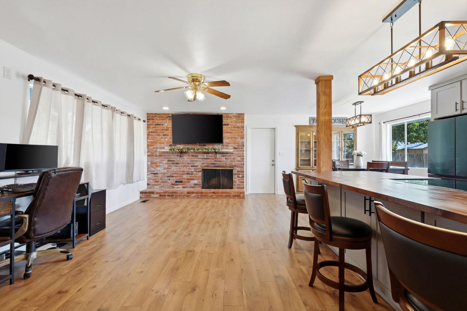 289 West Cypress Avenue Reedley, CA 93654 - Photo 11 of 45 a view of a livingroom with furniture and a fireplace
