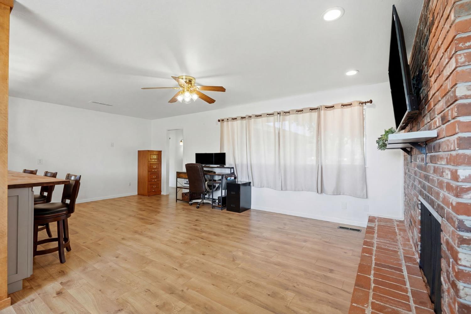 289 West Cypress Avenue Reedley, CA 93654 - Photo 13 of 45 a view of livingroom with furniture and a fireplace