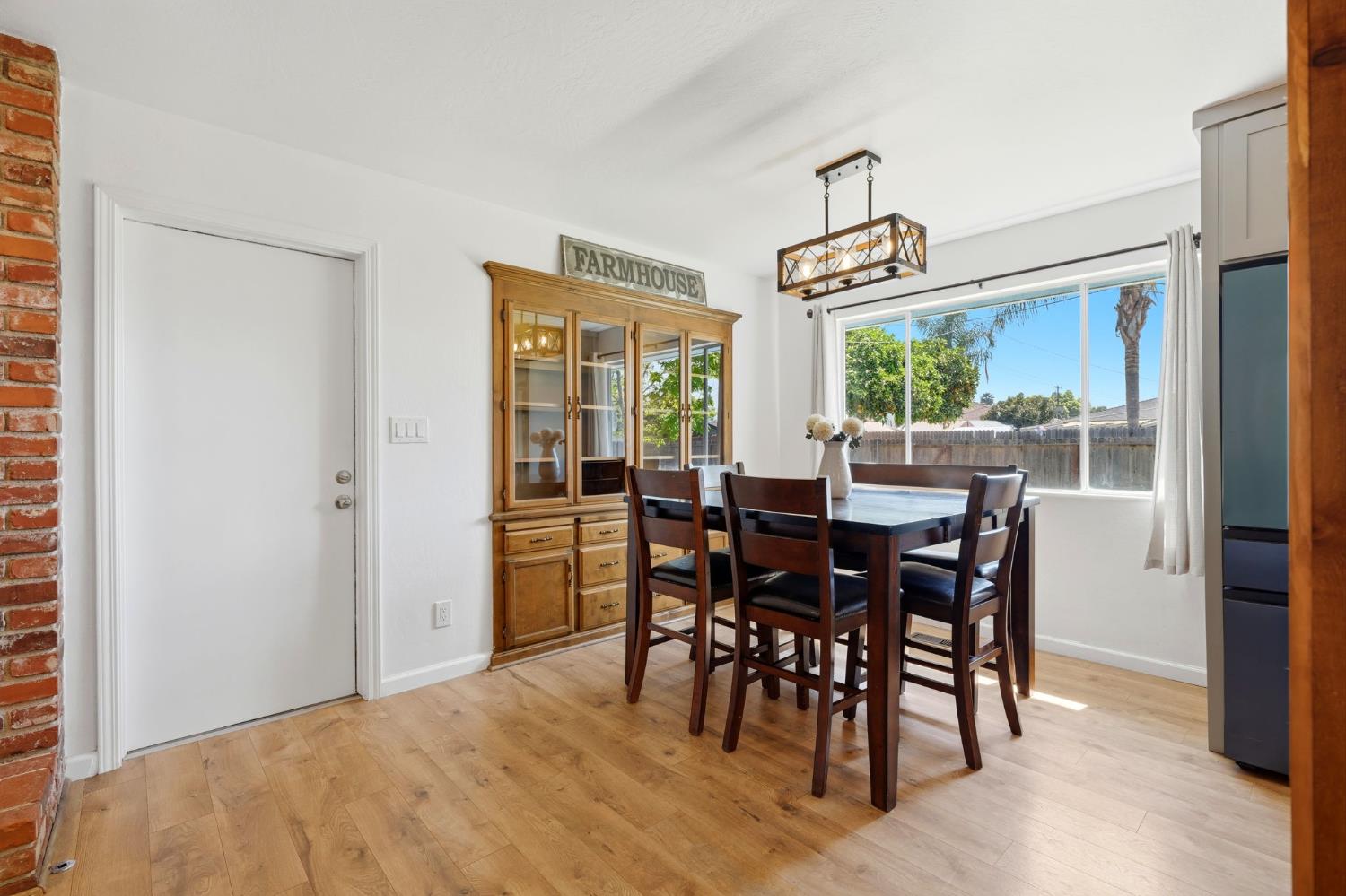 289 West Cypress Avenue Reedley, CA 93654 - Photo 14 of 45 a view of a dining room with furniture window and wooden floor