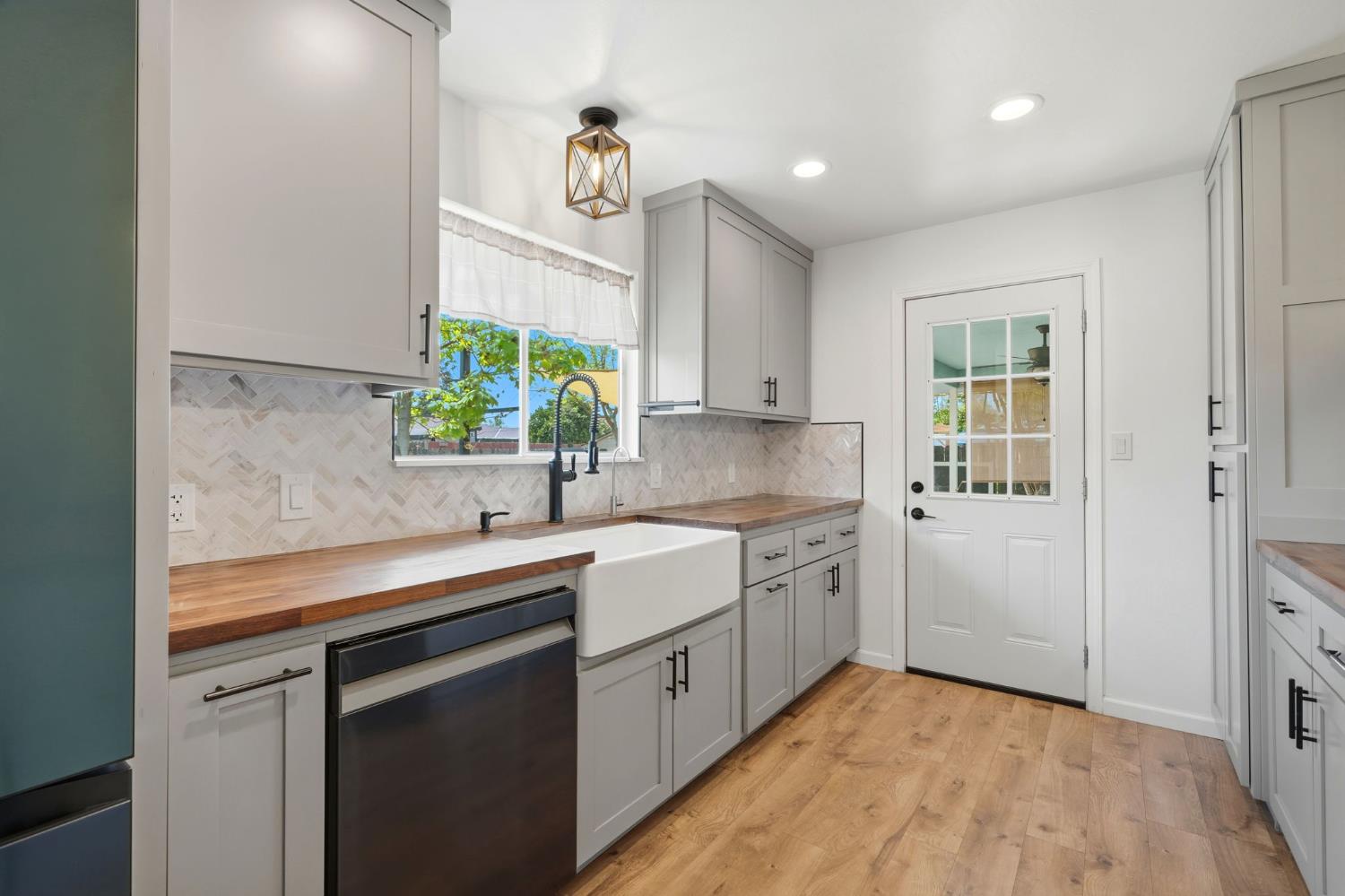 289 West Cypress Avenue Reedley, CA 93654 - Photo 18 of 45 a kitchen with a sink cabinets and window