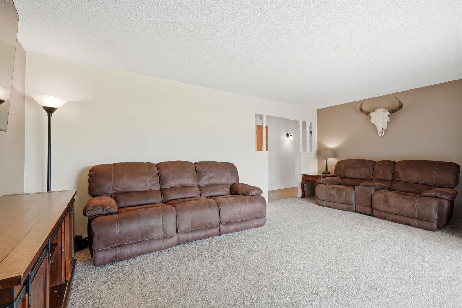 289 West Cypress Avenue Reedley, CA 93654 - Photo 21 of 45 a living room with a couch and a couch