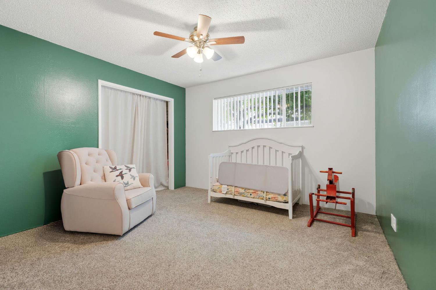 289 West Cypress Avenue Reedley, CA 93654 - Photo 24 of 45 a spacious bedroom with a bed and a couch