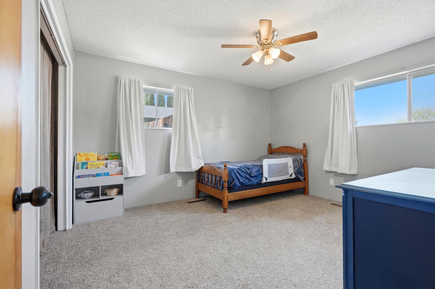 289 West Cypress Avenue Reedley, CA 93654 - Photo 26 of 45 a bedroom with furniture and window