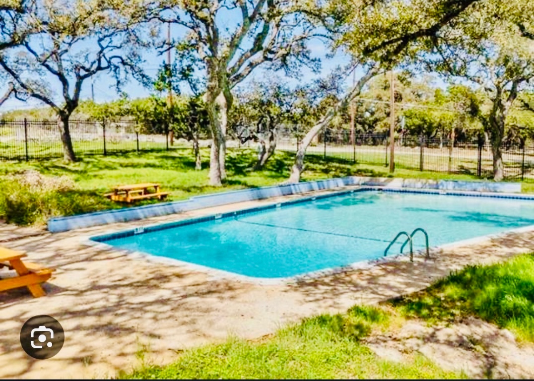 3120 Geronimo Trail Austin, TX 78734 - Photo 9 of 10 a view of a swimming pool with an outdoor space and seating area