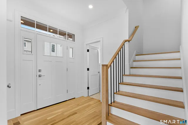a view of entryway with wooden floor