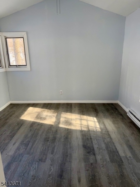 56 Appleseed Road Vernon, NJ 07461 - Photo 7 of 7 an empty room with wooden floor and windows