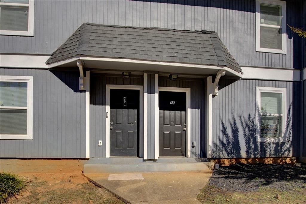a view of a house with a door and wooden floor
