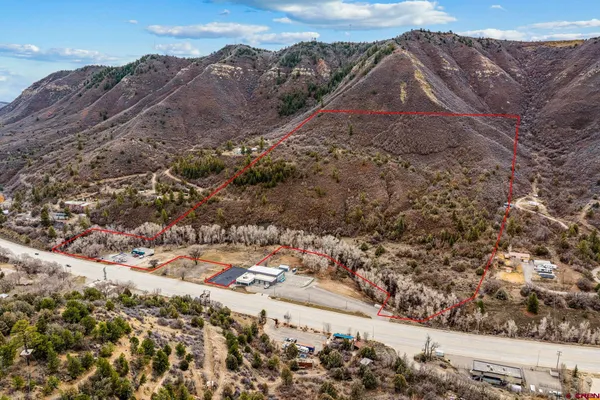 a view of a city with mountains in the background