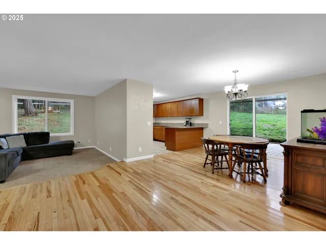 a view of a livingroom with furniture window and wooden floor