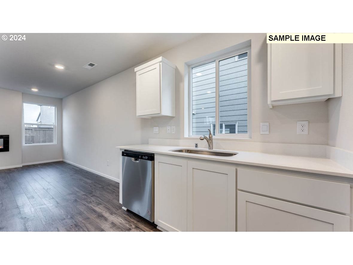 808 Northwest 175th Street Ridgefield, WA 98642 - Photo 8 of 29 a kitchen with sink and cabinets