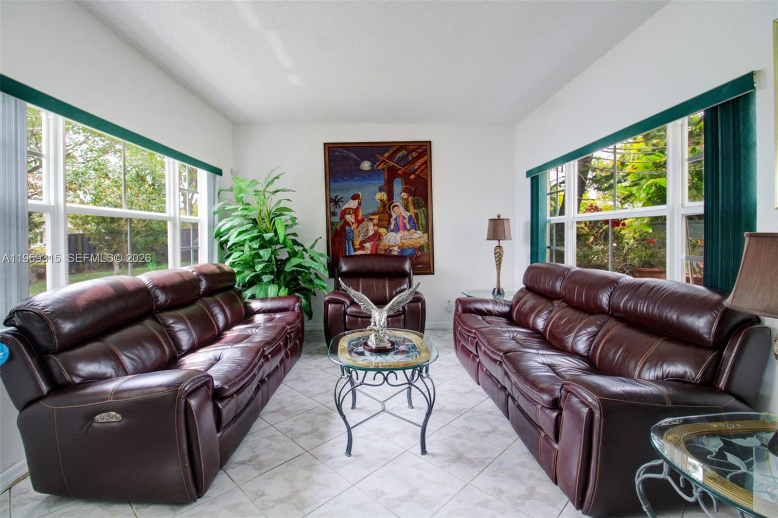 15490 Southwest 47th Street Miami, FL 33185 - Photo 11 of 43 a living room with furniture and a large window