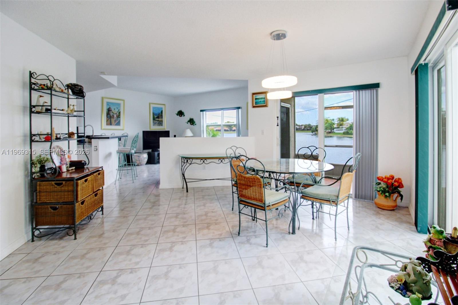 15490 Southwest 47th Street Miami, FL 33185 - Photo 14 of 43 a living room with furniture and a large window
