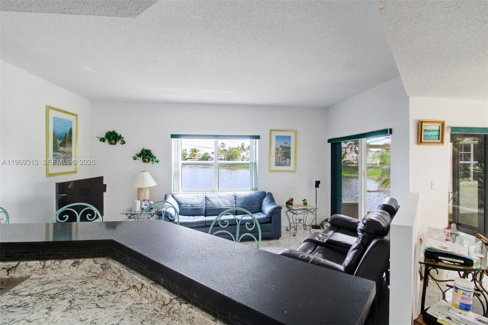 15490 Southwest 47th Street Miami, FL 33185 - Photo 16 of 43 a living room with furniture and a window