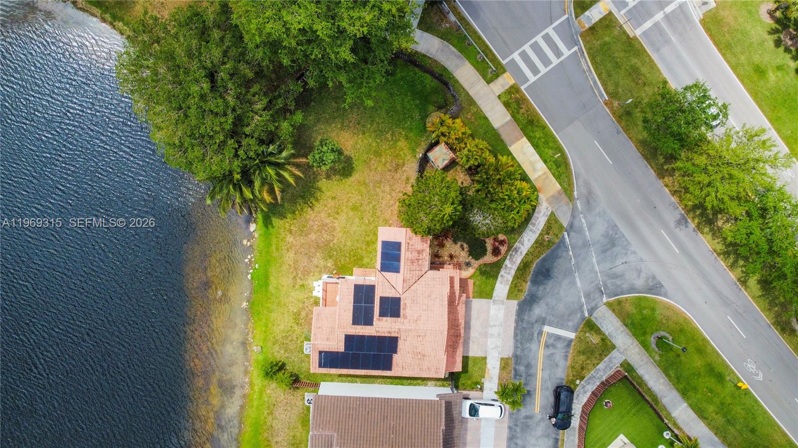 15490 Southwest 47th Street Miami, FL 33185 - Photo 2 of 43 an aerial view of a house with a swimming pool