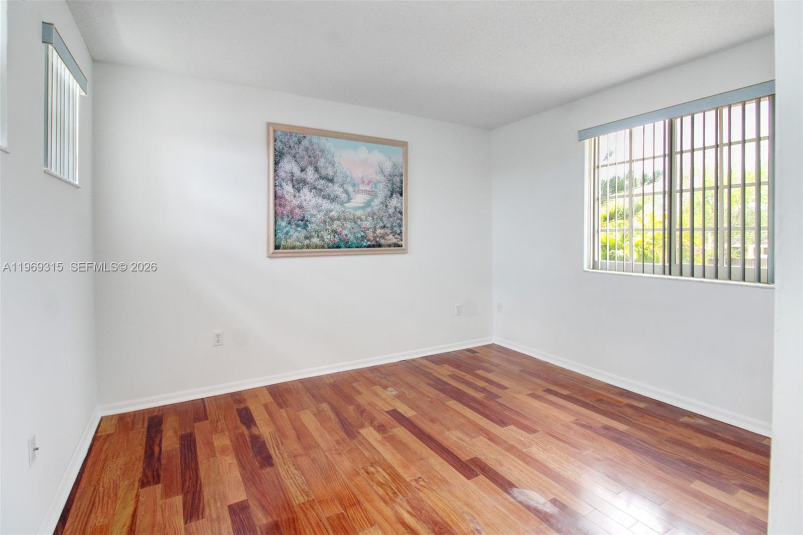 15490 Southwest 47th Street Miami, FL 33185 - Photo 21 of 43 a view of empty room with wooden floor