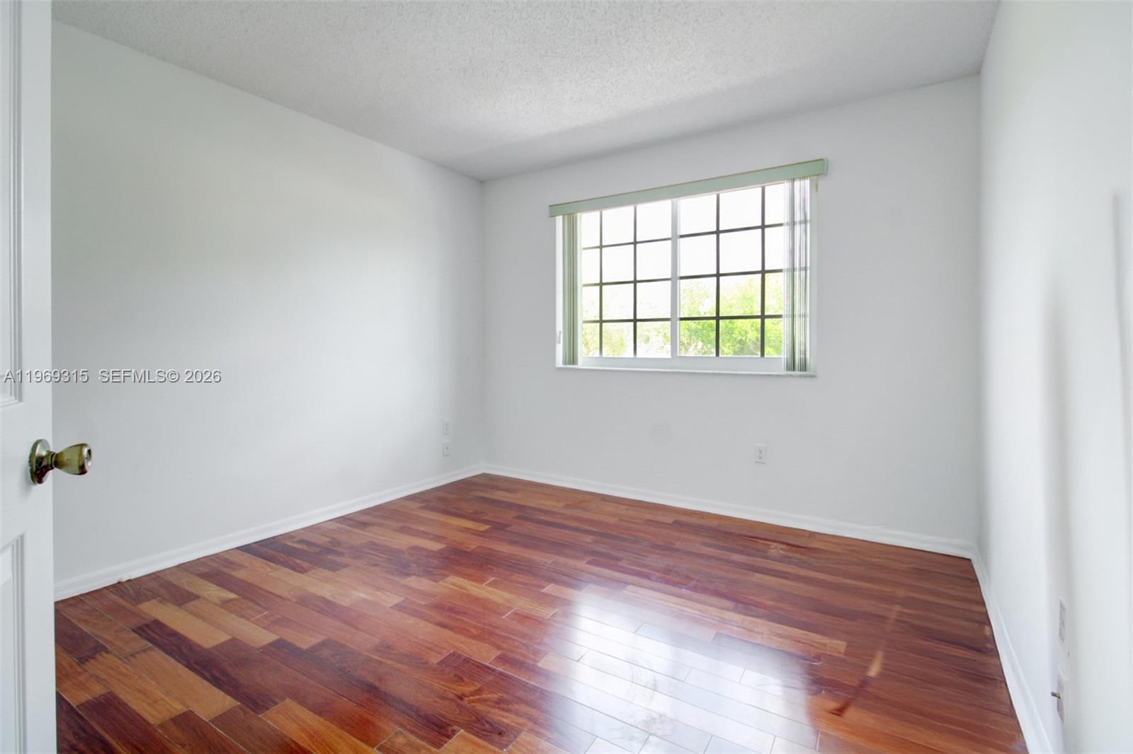15490 Southwest 47th Street Miami, FL 33185 - Photo 23 of 43 an empty room with a window
