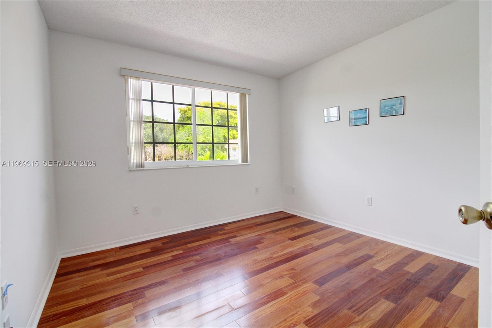 15490 Southwest 47th Street Miami, FL 33185 - Photo 24 of 43 a view of empty room with wooden floor