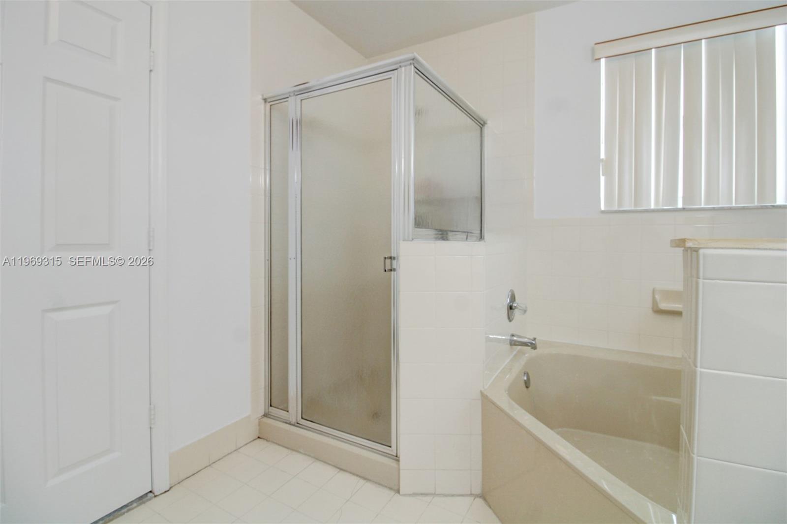 15490 Southwest 47th Street Miami, FL 33185 - Photo 29 of 43 a bathroom with a bathtub and a shower