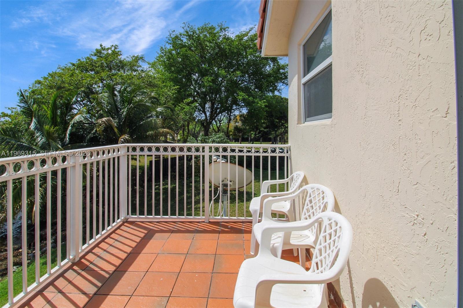 15490 Southwest 47th Street Miami, FL 33185 - Photo 30 of 43 a balcony with table and chairs