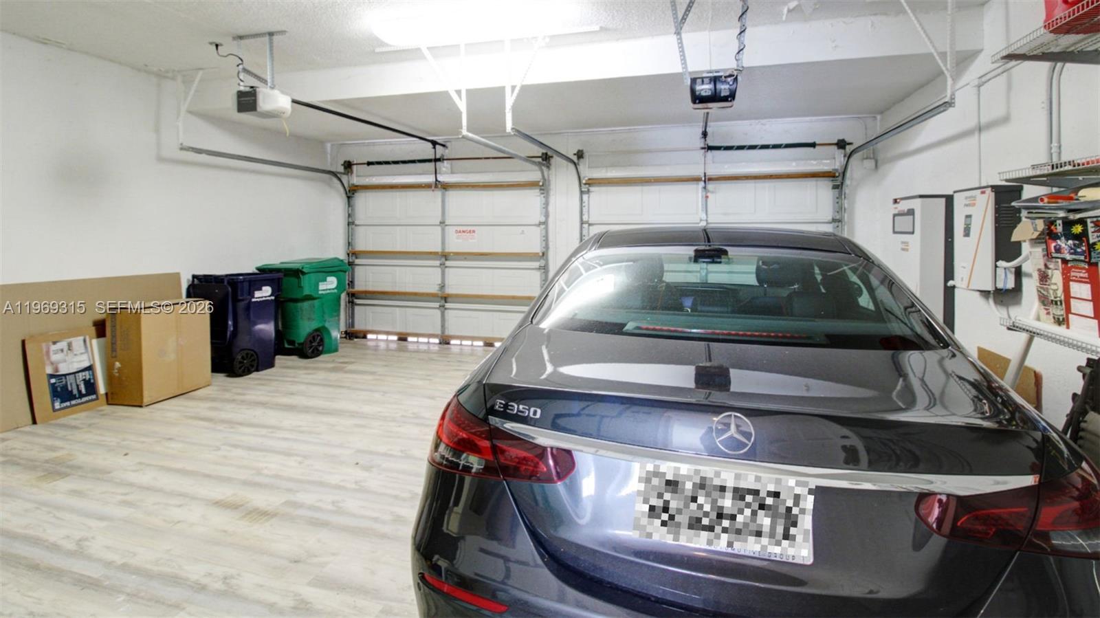 15490 Southwest 47th Street Miami, FL 33185 - Photo 31 of 43 a car parked in a garage