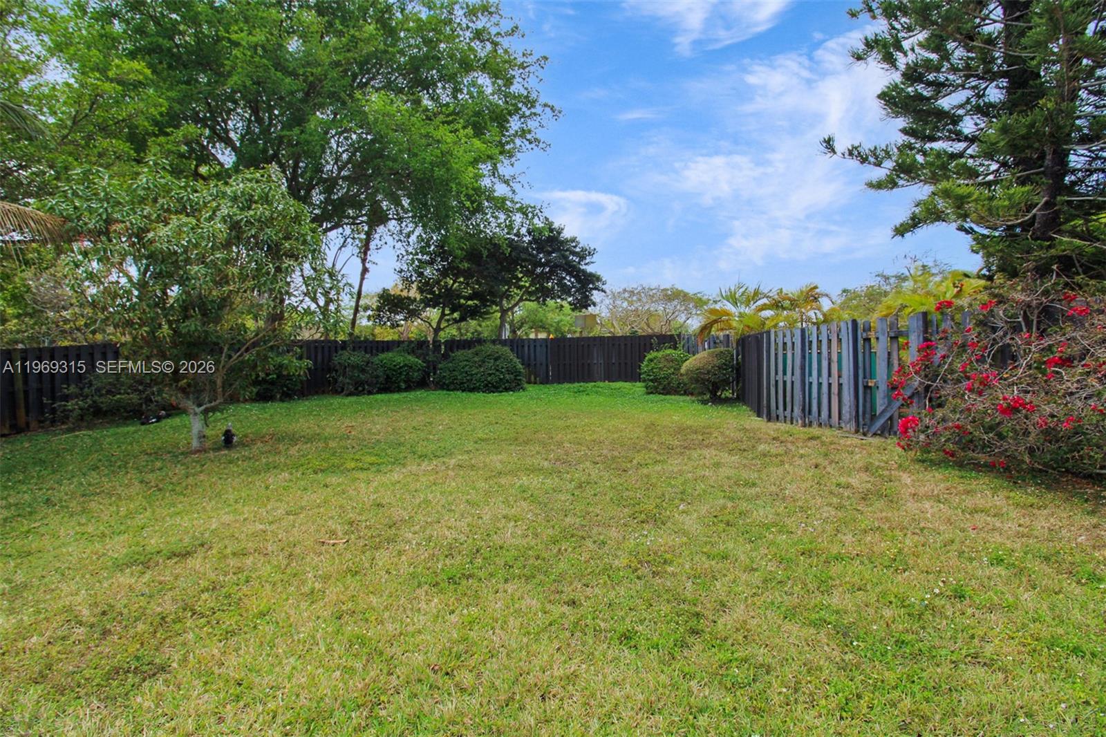 15490 Southwest 47th Street Miami, FL 33185 - Photo 35 of 43 a view of a backyard with a trampoline