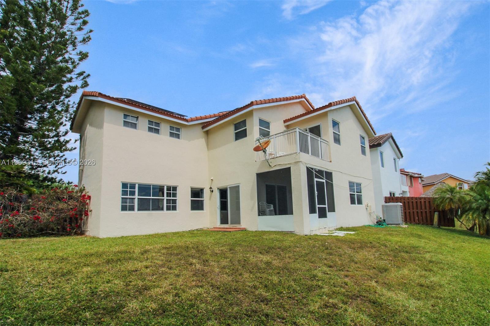 15490 Southwest 47th Street Miami, FL 33185 - Photo 38 of 43 a front view of a house with a garden