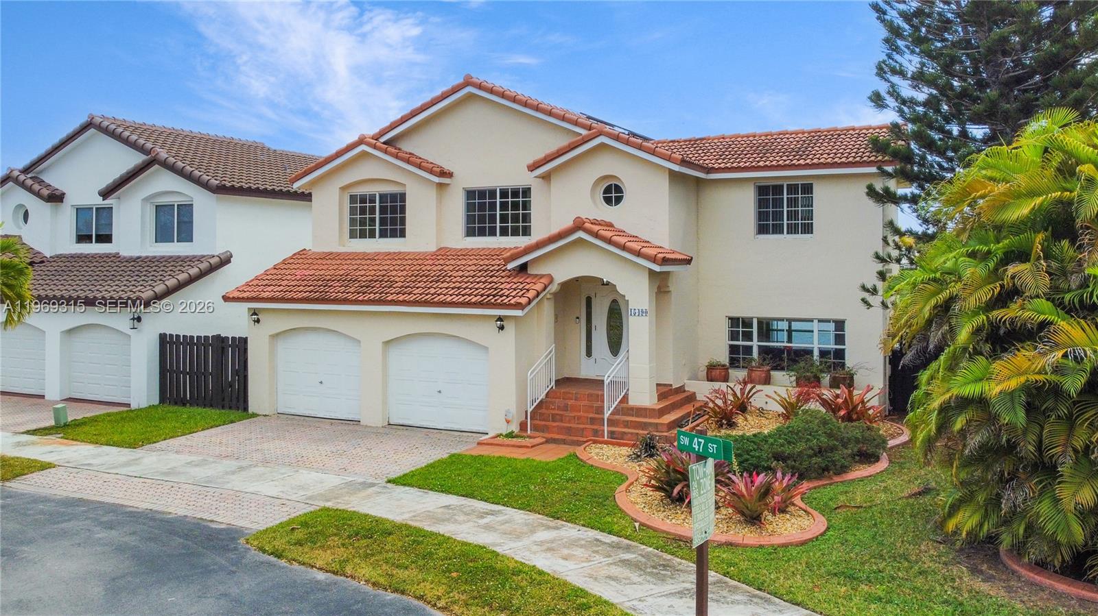 15490 Southwest 47th Street Miami, FL 33185 - Photo 40 of 43 a front view of a house with garden
