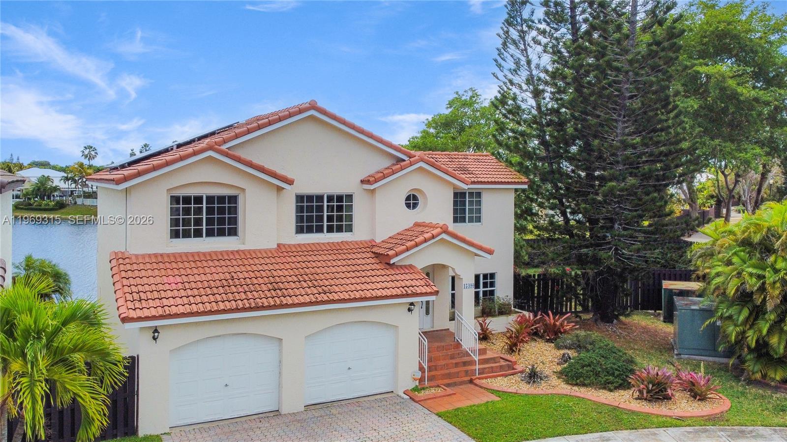 15490 Southwest 47th Street Miami, FL 33185 - Photo 41 of 43 a front view of a house with garden
