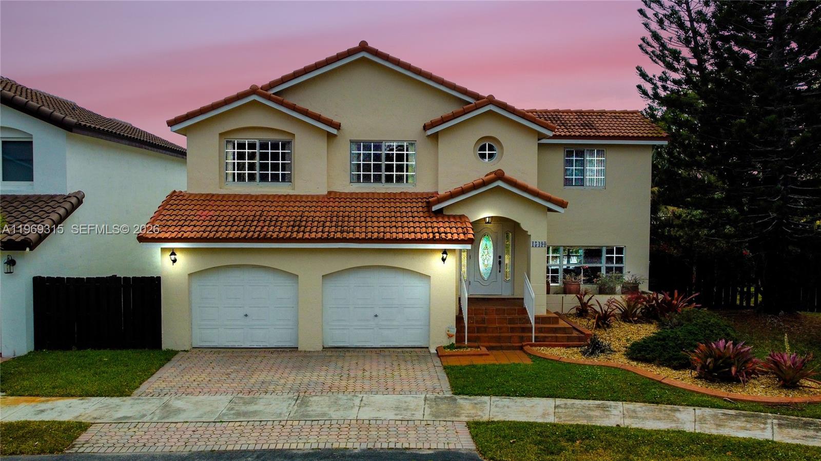 15490 Southwest 47th Street Miami, FL 33185 - Photo 6 of 43 a front view of a house with garden