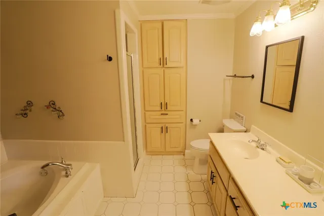 a bathroom with a sink a granite counter and a mirror