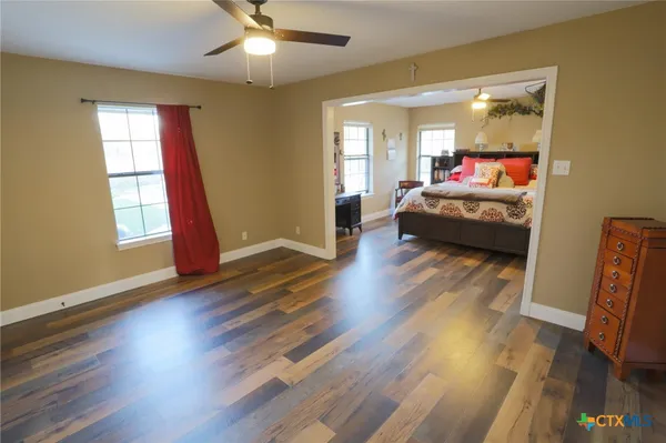 a bedroom with furniture and a window