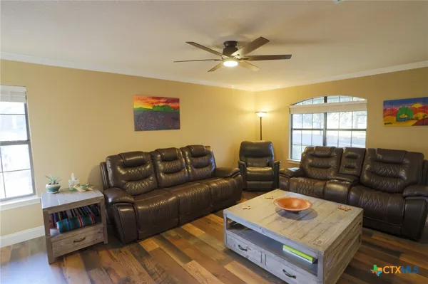 a living room with furniture and a window