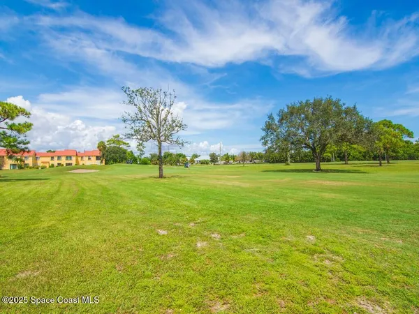 a view of a golf course with a lake