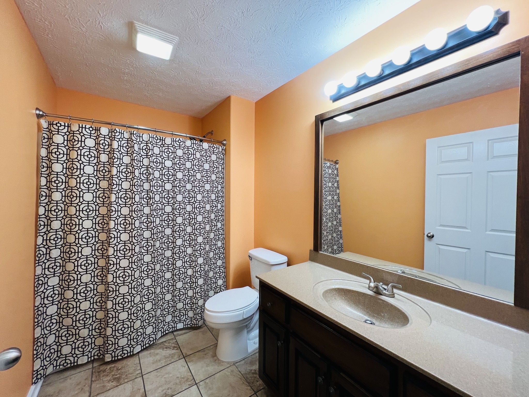 663 Jackson Road Portland, TN 37148 - Photo 26 of 32 a bathroom with a granite countertop sink toilet and shower