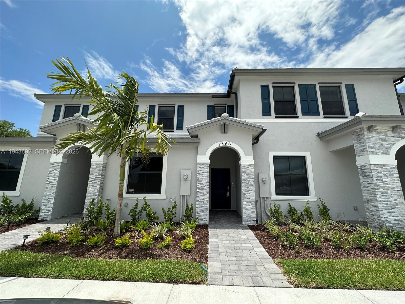 front view of a house with a yard
