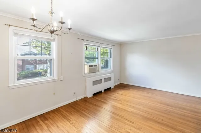 a kitchen with stainless steel appliances granite countertop a refrigerator and a stove