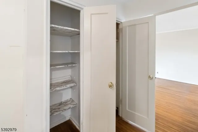 a view of a brick house with a yard