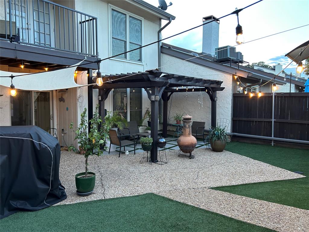 9446 Chimney Corner Dallas, TX 75243 - Photo 13 of 15 a view of a patio with table and chairs potted plants