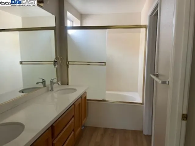 a bathroom with a sink and mirror
