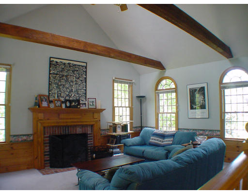 16 Newcombs Mill Road Kingston, MA 02364 - Photo 3 of 6 a living room with furniture and a fireplace