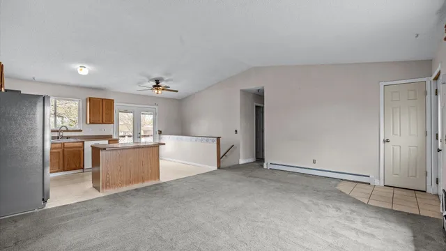 a view of a kitchen with a sink and cabinets