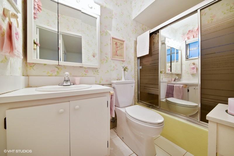 438 Dover Road Tequesta, FL 33469 - Photo 7 of 10 a bathroom with a sink toilet vanity and shower