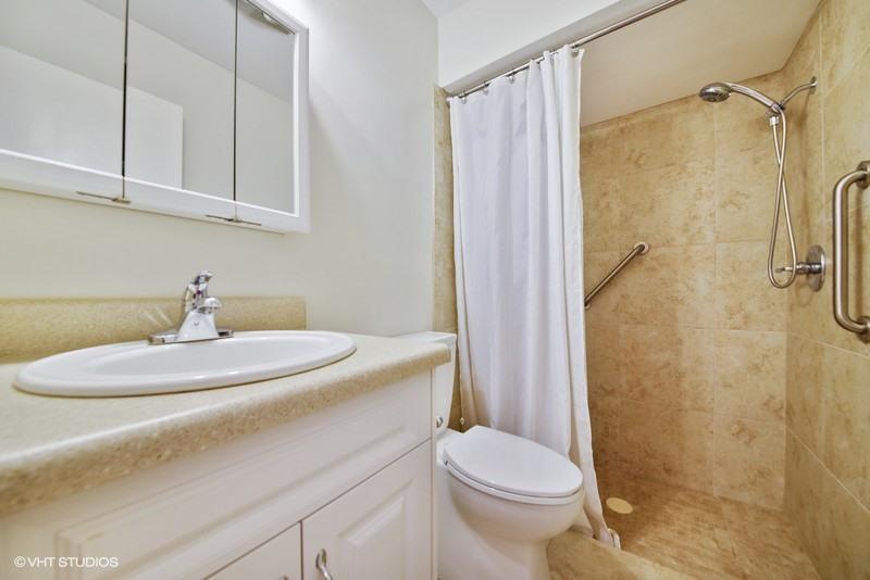 438 Dover Road Tequesta, FL 33469 - Photo 9 of 10 a bathroom with a sink a toilet and shower