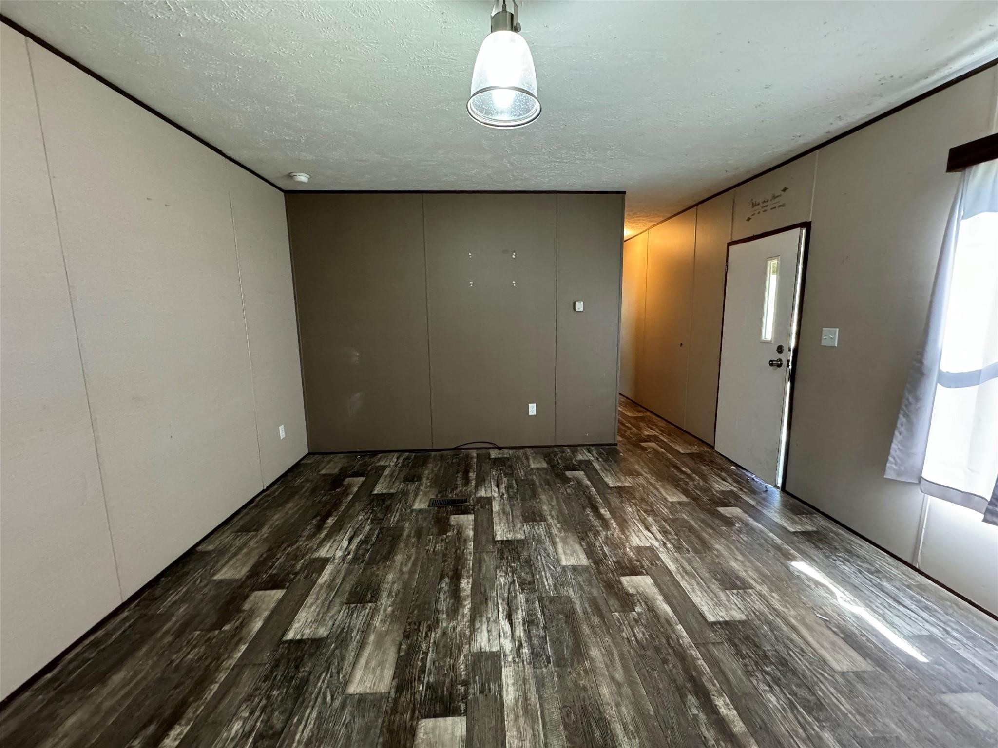18093 Pickering Road Conroe, TX 77302 - Photo 14 of 29 a view of a room with wooden floor and windows