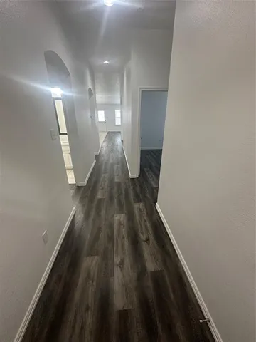 a view of gallery with wooden floor